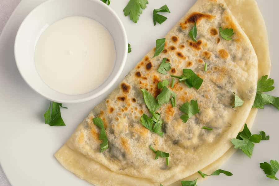 Azerbaijani Cooking Class & Old City Tour & Lunch - Turning grape leaves and dough into lunch